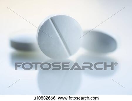 Stock Photograph - Studio shot of white pills. Fotosearch