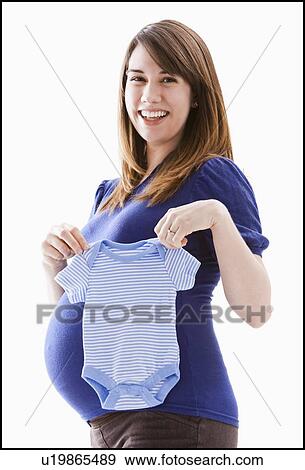 Studio Shot of woman holing baby blue onesie View Large Photo Image Stock Photo - Studio Shot of woman holing baby blue onesie. Fotosearch