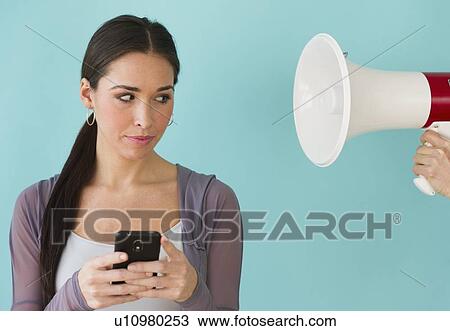 Studio shot of woman texting View Large Photo Image Stock Image - Studio shot of woman texting. Fotosearch