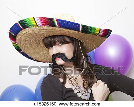 Studio Shot of young woman dressed up as Mexican View Large Photo Image Stock Image - Studio Shot of young woman dressed up as Mexican. Fotosearch