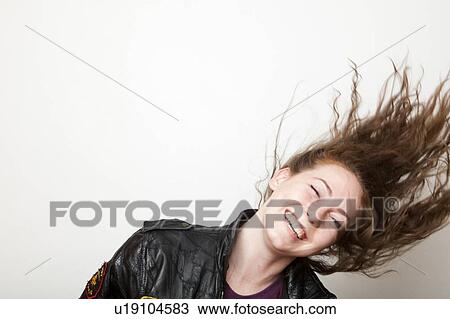 Stock Image - Studio Shot of young woman shaking head. Fotosearch