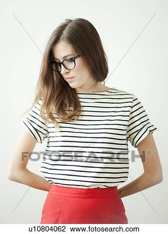 Stock Image - Studio shot of young woman. Fotosearch