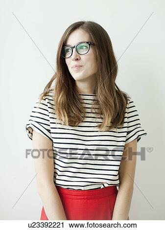 Stock Image - Studio shot of young woman. Fotosearch