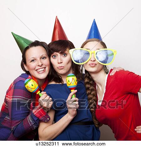 Studio Shot of young women dressed in party hat View Large Photo Image Stock Image - Studio Shot of young women dressed in party hat. Fotosearch