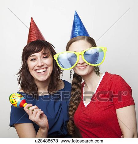 Studio Shot of young women dressed in party hat View Large Photo Image Stock Photo - Studio Shot of young women dressed in party hat. Fotosearch