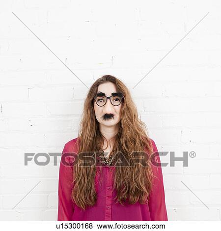Studio Shot portrait of young woman in artificial nose View Large Photo Image Stock Photo - Studio Shot portrait of young woman in artificial nose. Fotosearch
