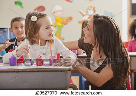 Teacher with children (2-3, 4-5, 6-7) during art classes View Large Photo Image Stock Image - Teacher with children (2-3, 4-5, 6-7) during art classes. Fotosearch