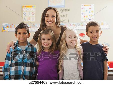 Teacher with children (2-3, 4-5, 6-7) at school View Large Photo Image Stock Photo - Teacher with children (2-3, 4-5, 6-7) at school. Fotosearch