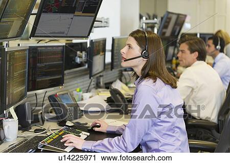 Traders at trading desk View Large Photo Image Stock Image - Traders at trading desk. Fotosearch
