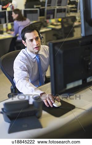 Traders at trading desk View Large Photo Image Stock Image - Traders at trading desk. Fotosearch