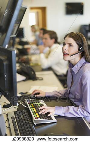 Traders at trading desk View Large Photo Image Stock Image - Traders at trading desk. Fotosearch