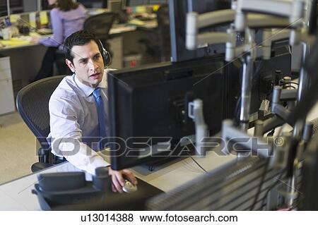 Traders at trading desk View Large Photo Image Stock Photo - Traders at trading desk. Fotosearch