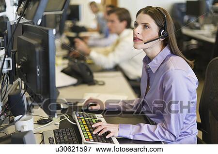 Traders at trading desk View Large Photo Image Stock Photo - Traders at trading desk. Fotosearch