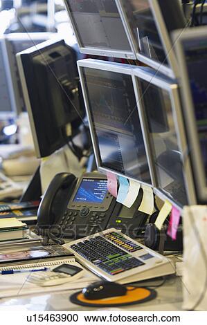 Trading desk with computers and phones View Large Photo Image Stock Image - Trading desk with computers and phones. Fotosearch