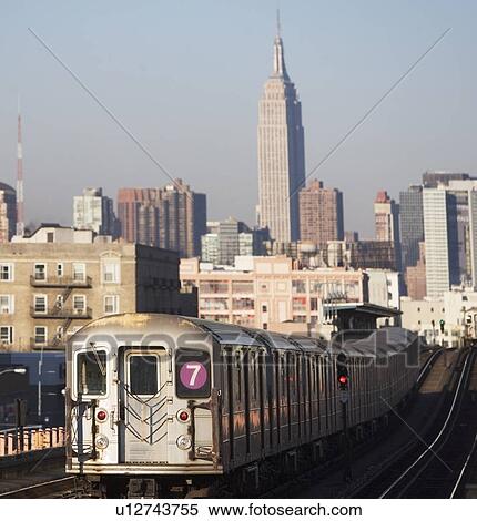 Train going to city center View Large Photo Image Stock Photography - Train going to city center. Fotosearch