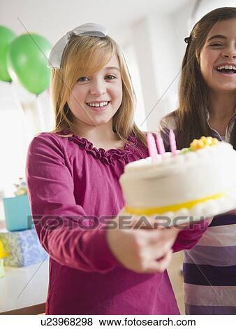 Stock Photo - Two girls celebrating birthday. Fotosearch