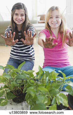 Stock Photo -  Two girls gardening. Fotosearch