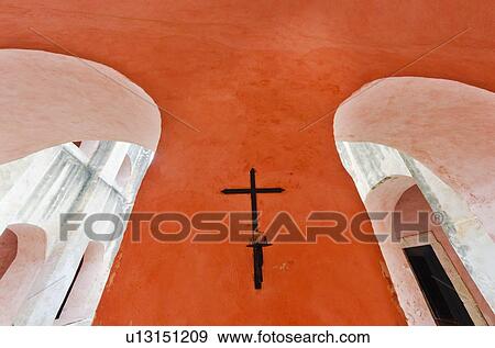 Valladolid, Crucifix on orange wall View Large Photo Image Stock Photo - Valladolid, Crucifix on orange wall. Fotosearch