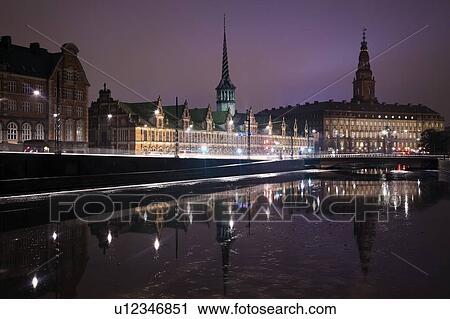 Stock Image - View over canal towards Copenhagen Stock Exchange and Christiansborg Castle. Fotosearch