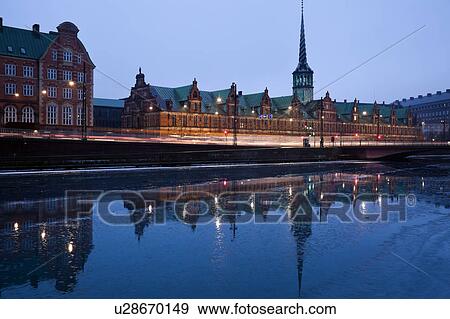 Stock Photo - View over canal towards Copenhagen Stock Exchange and Christiansborg Castle. Fotosearch