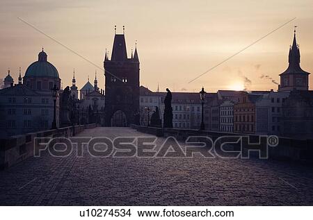 View over Charles Bridge towards Prague Castle in early morning View Large Photo Image Picture - View over Charles Bridge towards Prague Castle in early morning. Fotosearch