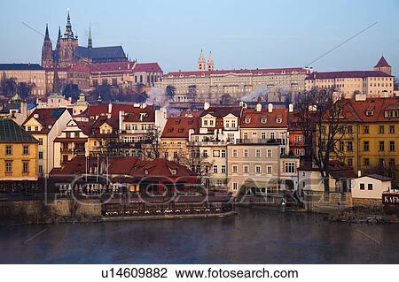 Stock Image - View over Vltava River towards Prague Castle in early morning. Fotosearch