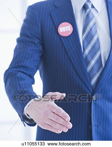 Stock Image - Vote pin on man's lapel. Fotosearch