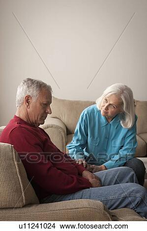 Picture - Woman comforting sad senior man. Fotosearch