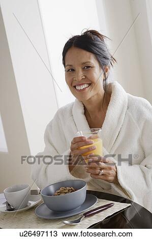 Woman having breakfast View Large Photo Image Stock Image - Woman having breakfast. Fotosearch