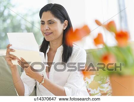 Stock Photo - Woman reading letter. Fotosearch