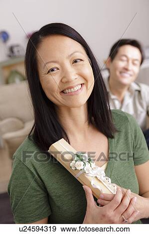 Woman receiving gift from man View Large Photo Image Stock Photo - Woman receiving gift from man. Fotosearch