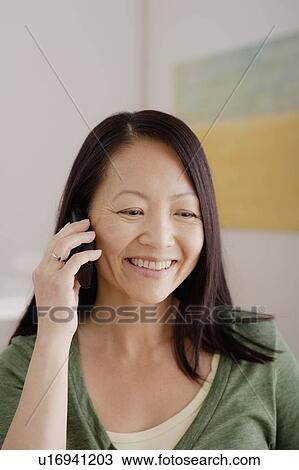 Woman talking on phone View Large Photo Image Stock Image - Woman talking on phone. Fotosearch