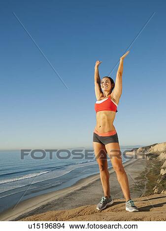 Woman training on coast View Large Photo Image Picture - Woman training on coast. Fotosearch