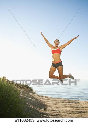 Woman training on coast View Large Photo Image Stock Image - Woman training on coast. Fotosearch