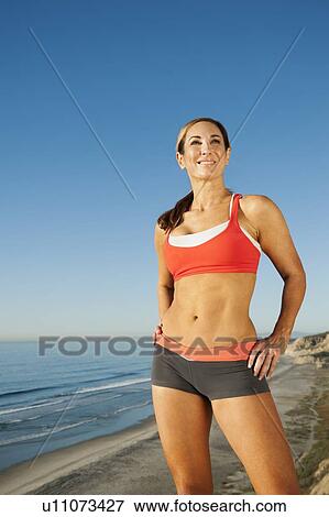 Woman training on coast View Large Photo Image Stock Photo - Woman training on coast. Fotosearch