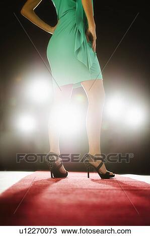 Stock Image - Woman wearing mini dress on catwalk. Fotosearch