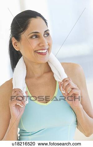 Woman with towel on shoulders View Large Photo Image Stock Image - Woman with towel on shoulders. Fotosearch