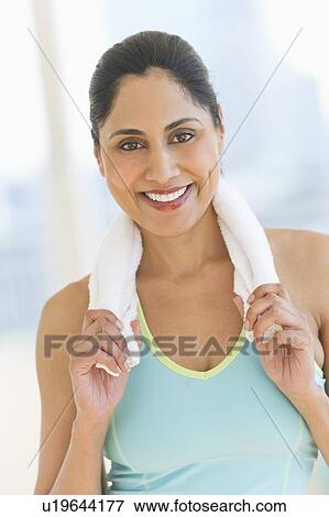 Stock Photo - Woman with towel on shoulders. Fotosearch