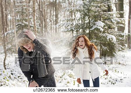 Young couple are having snowball fight View Large Photo Image Stock Photography - Young couple are having snowball fight. Fotosearch