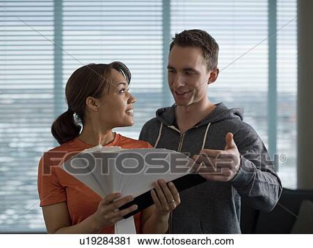 Young couple choosing color from color swatch View Large Photo Image Stock Image - Young couple choosing color from color swatch. Fotosearch