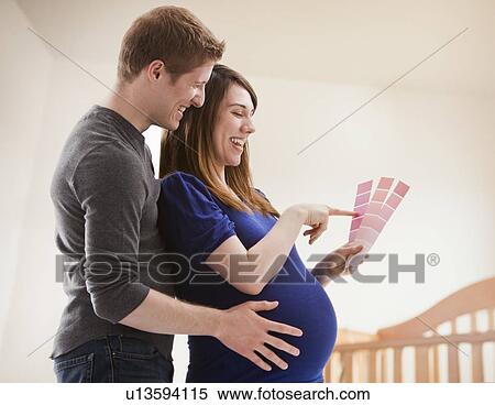 Young couple choosing color from Paint Sample Cards View Large Photo Image Stock Photography - Young couple choosing color from Paint Sample Cards. Fotosearch