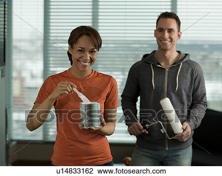 Young couple preparing for painting their home View Large Photo Image Stock Image - Young couple preparing for painting their home. Fotosearch