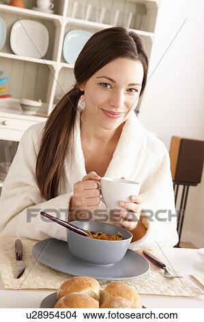 Young smiling woman at breakfast View Large Photo Image Picture - Young smiling woman at breakfast. Fotosearch