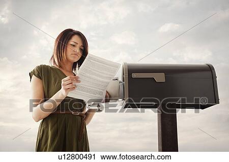 Young woman at mailbox View Large Photo Image Stock Image - Young woman at mailbox. Fotosearch