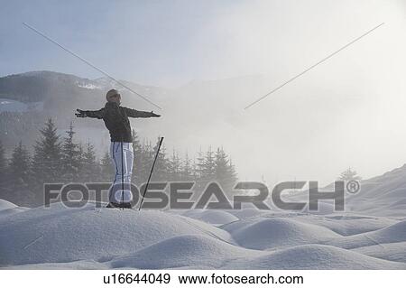 Young woman hiking in winter scenery View Large Photo Image Stock Photo - Young woman hiking in winter scenery. Fotosearch