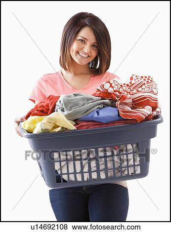 Young woman with laundry basket View Large Photo Image Stock Photo - Young woman with laundry basket. Fotosearch