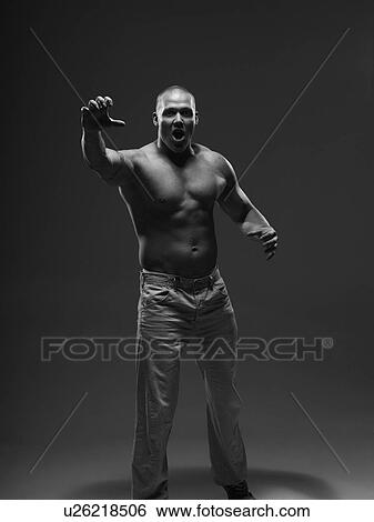 Athlete shouting indoors View Large Photo Image Stock Photograph - Athlete shouting indoors. Fotosearch