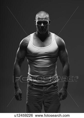 Athlete wearing tank top indoors View Large Photo Image Stock Photograph - Athlete wearing tank top indoors. Fotosearch