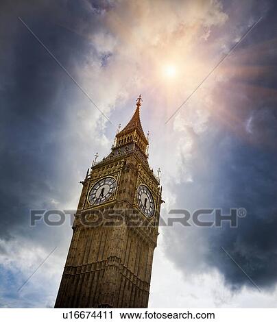 Stock Image - Big Ben clock tower in cloudy sky. Fotosearch