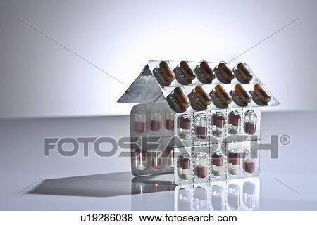 Blister packs of pills in shape of house View Large Photo Image Stock Photo - Blister packs of pills in shape of house. Fotosearch